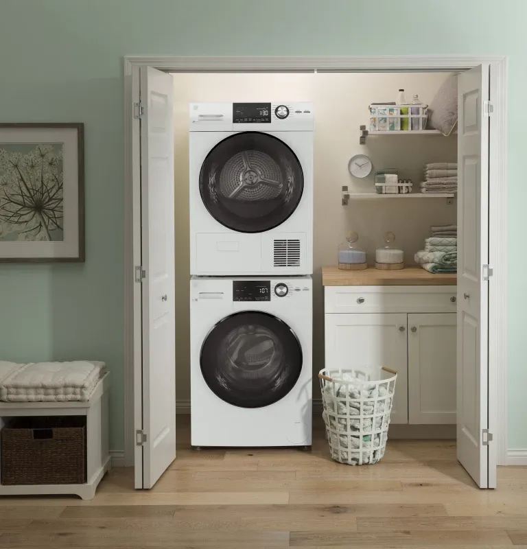 A front load washer and dryer stacked on top of one another in a laundry area.