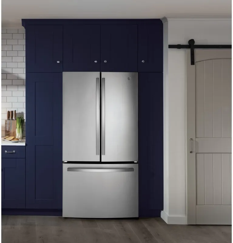 A GE refrigerator inside a kitchen.